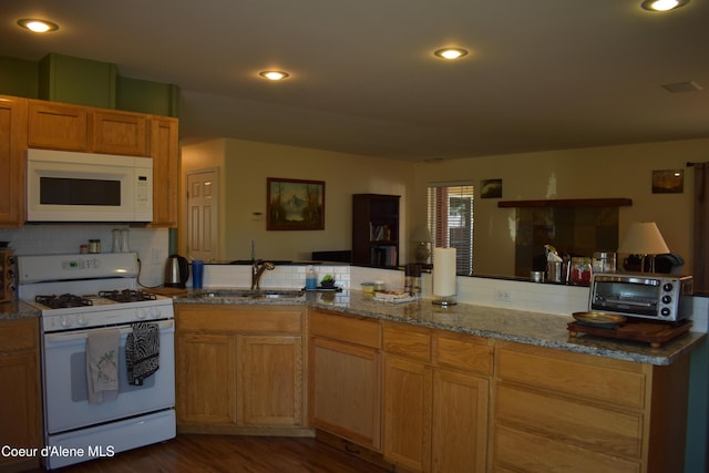 1406 Walnut, Sandpoint, ID 83864 - kitchen featuring white appliances, backsplash, dark wood-style flooring, a sink, and recessed lighting