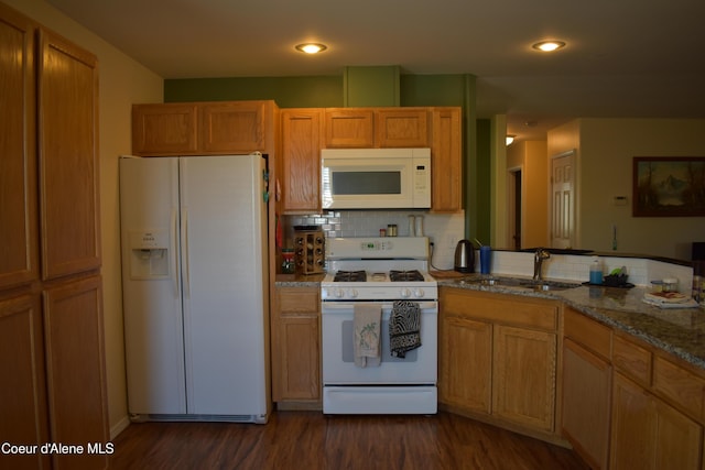 1406 Walnut, Sandpoint, ID 83864 - kitchen featuring white appliances, a sink, decorative backsplash, dark wood-style floors, and recessed lighting