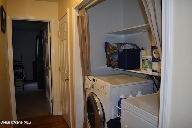 1406 Walnut, Sandpoint, ID 83864 - washroom with washer and clothes dryer and wood finished floors