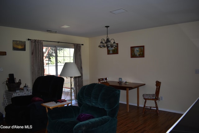1406 Walnut, Sandpoint, ID 83864 - living area featuring wood finished floors, a chandelier, and baseboards