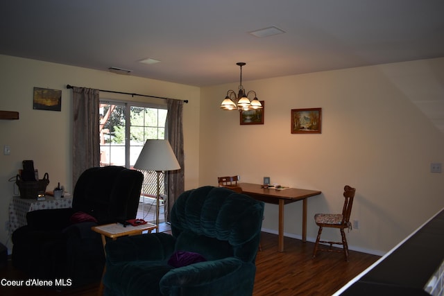1406 Walnut, Sandpoint, ID 83864 - living area with wood finished floors, a chandelier, and baseboards