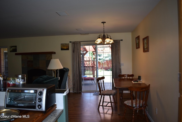 1406 Walnut, Sandpoint, ID 83864 - dining area featuring wood finished floors and a chandelier