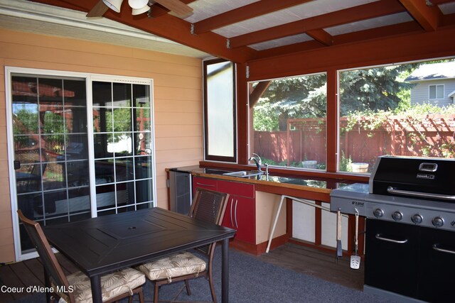 1406 Walnut, Sandpoint, ID 83864 - sunroom / solarium featuring a sink, beam ceiling, wooden walls, and wood finished floors