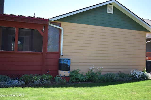 1406 Walnut, Sandpoint, ID 83864 - view of property exterior featuring a lawn and a sunroom