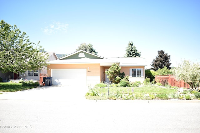 1406 Walnut, Sandpoint, ID 83864 - ranch-style home featuring an attached garage and concrete driveway