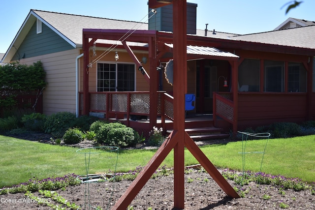 1406 Walnut, Sandpoint, ID 83864 - rear view of property featuring a chimney, roof with shingles, and a yard
