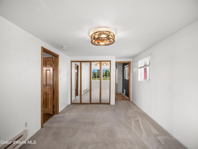 409 N 2nd St, Fairfield, WA 99012 - unfurnished room featuring a baseboard heating unit, light colored carpet, and a smoke detector