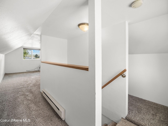 409 N 2nd St, Fairfield, WA 99012 - staircase with a baseboard radiator, carpet, and lofted ceiling