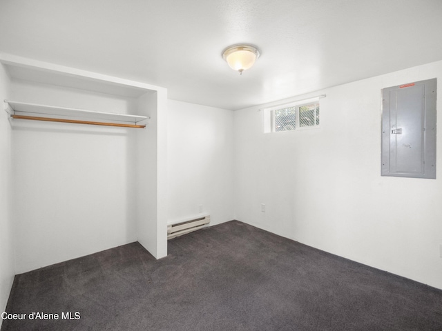 409 N 2nd St, Fairfield, WA 99012 - unfurnished bedroom with electric panel, a baseboard heating unit, and dark carpet
