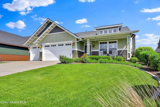 14774 N Pristine Cir, Rathdrum, ID 83858 - craftsman inspired home featuring an attached garage, a front yard, driveway, a porch, and board and batten siding