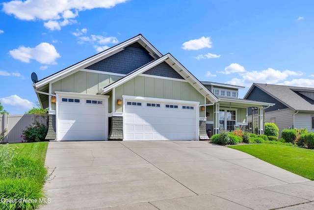 14774 N Pristine Cir, Rathdrum, ID 83858 - craftsman-style home featuring board and batten siding, driveway, an attached garage, and a porch