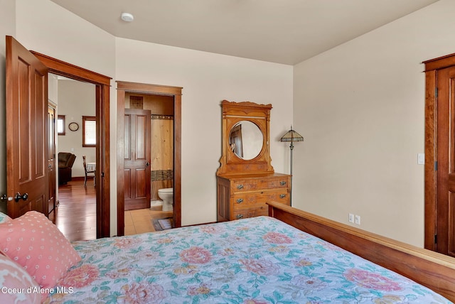 14774 N Pristine Cir, Rathdrum, ID 83858 - bedroom with light wood finished floors and ensuite bathroom