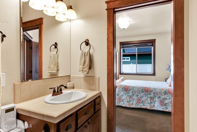 14774 N Pristine Cir, Rathdrum, ID 83858 - ensuite bathroom featuring vanity and decorative backsplash