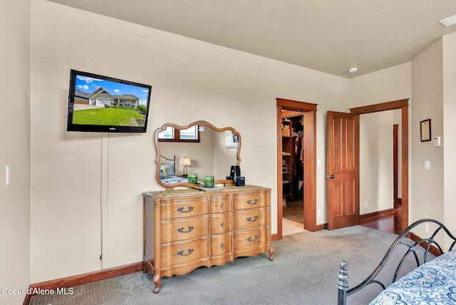 14774 N Pristine Cir, Rathdrum, ID 83858 - bedroom with carpet flooring, a walk in closet, and baseboards