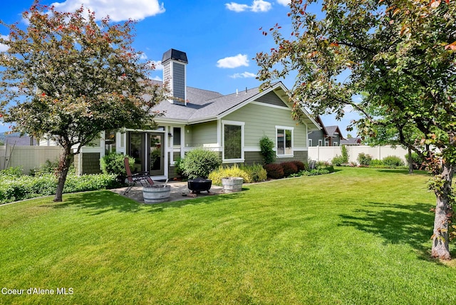 14774 N Pristine Cir, Rathdrum, ID 83858 - rear view of property featuring a patio, a chimney, and roof with shingles