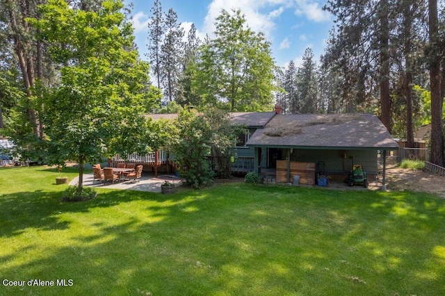 201 S Sequoia Ct, Post Falls, ID 83854 - rear view of property with a patio and a chimney