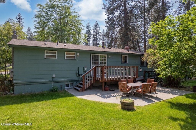 201 S Sequoia Ct, Post Falls, ID 83854 - rear view of property featuring a patio, a lawn, a deck, and a chimney