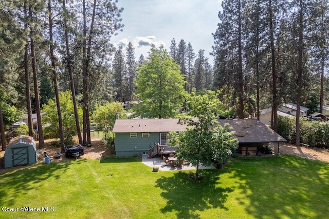 201 S Sequoia Ct, Post Falls, ID 83854 - back of house featuring a lawn, a patio area, and a deck