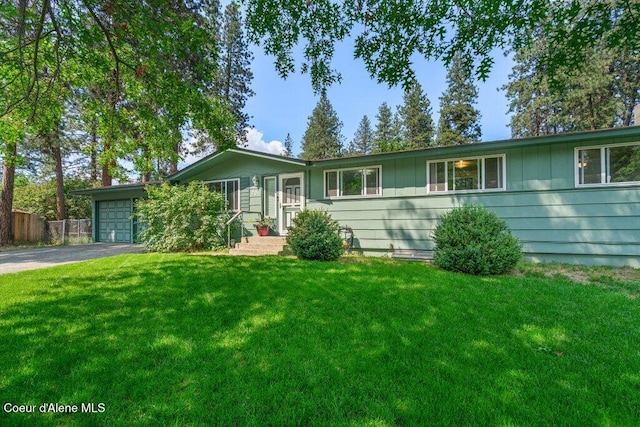 201 S Sequoia Ct, Post Falls, ID 83854 - ranch-style house featuring asphalt driveway and an attached garage