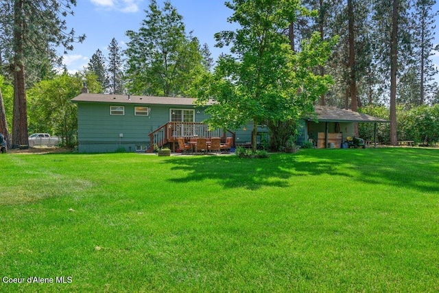 201 S Sequoia Ct, Post Falls, ID 83854 - back of property with a yard, a wooden deck, and a chimney