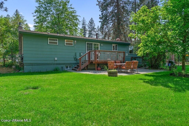 201 S Sequoia Ct, Post Falls, ID 83854 - back of house with a patio, a wooden deck, a lawn, and a chimney