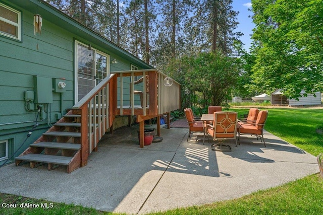 201 S Sequoia Ct, Post Falls, ID 83854 - view of patio featuring outdoor dining space, a wooden deck, and stairway