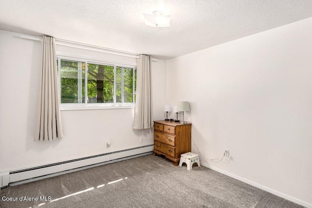 201 S Sequoia Ct, Post Falls, ID 83854 - unfurnished room with a baseboard radiator, carpet floors, a textured ceiling, and baseboards