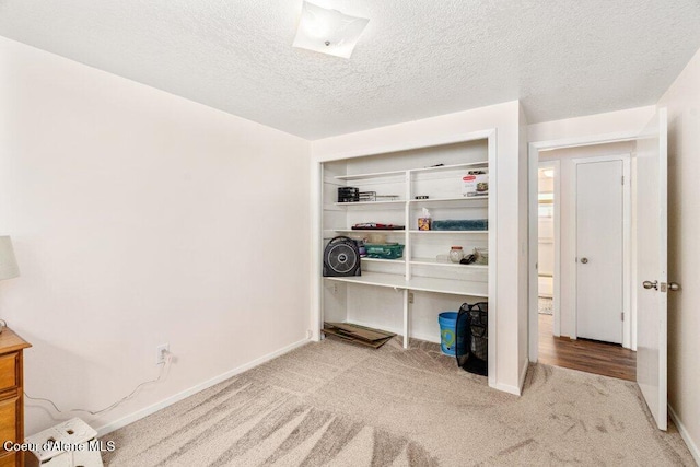 201 S Sequoia Ct, Post Falls, ID 83854 - unfurnished bedroom featuring carpet floors, a textured ceiling, a closet, and baseboards