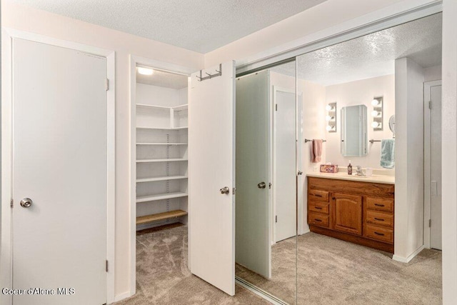 201 S Sequoia Ct, Post Falls, ID 83854 - bathroom featuring vanity and a textured ceiling