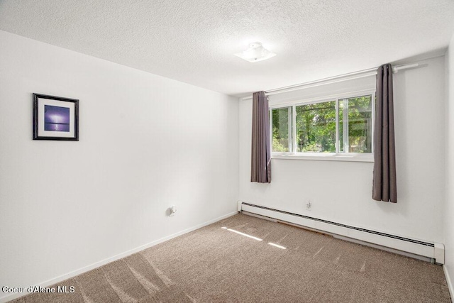 201 S Sequoia Ct, Post Falls, ID 83854 - unfurnished room featuring baseboard heating, carpet, a textured ceiling, and baseboards