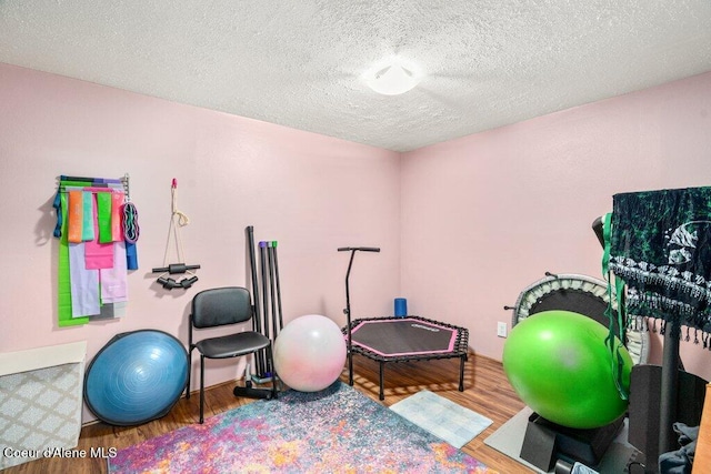 201 S Sequoia Ct, Post Falls, ID 83854 - workout area featuring wood finished floors and a textured ceiling