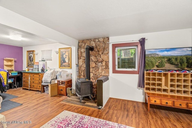 201 S Sequoia Ct, Post Falls, ID 83854 - living room featuring a wood stove and wood finished floors