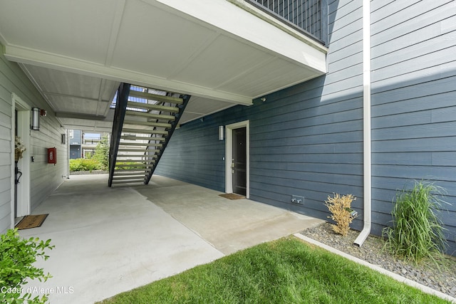 6430 N Atlas Rd Unit 101, Coeur Dalene, ID 83815 - view of patio / terrace featuring stairway and a carport