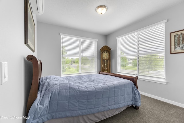 6430 N Atlas Rd Unit 101, Coeur Dalene, ID 83815 - carpeted bedroom with baseboards and a wall unit AC
