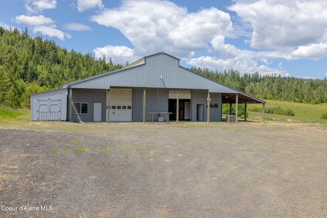 1995 Long Rd, Plummer, ID 83851 - view of pole building featuring a wooded view and driveway