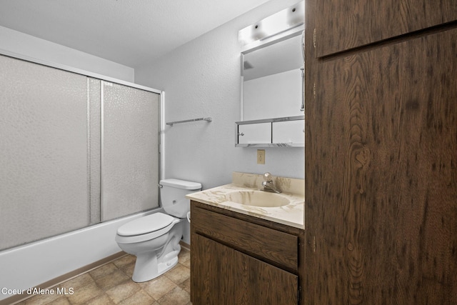 1995 Long Rd, Plummer, ID 83851 - bathroom featuring vanity, toilet, and bath / shower combo with glass door