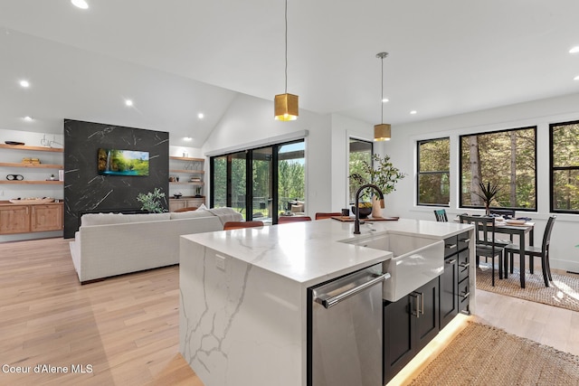 11733 N Blue Jay Loop, Hayden, ID 83835 - kitchen with stainless steel dishwasher, a sink, light wood-style floors, recessed lighting, and hanging light fixtures