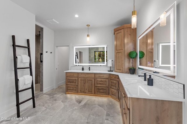 11733 N Blue Jay Loop, Hayden, ID 83835 - bathroom with tasteful backsplash, double vanity, a walk in shower, stone finish floors, and recessed lighting