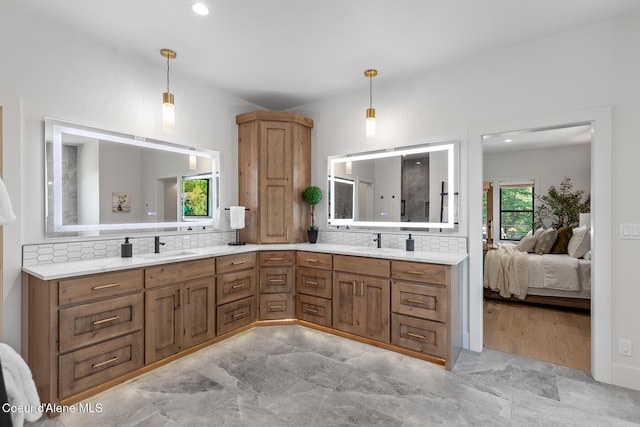 11733 N Blue Jay Loop, Hayden, ID 83835 - full bath featuring double vanity, decorative backsplash, connected bathroom, and recessed lighting
