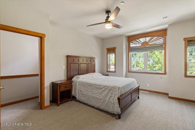 303 S 11th St, Coeur Dalene, ID 83814 - bedroom featuring light colored carpet, baseboards, and a ceiling fan
