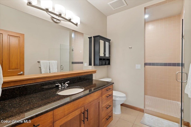 303 S 11th St, Coeur Dalene, ID 83814 - full bathroom featuring a stall shower, vanity, toilet, tile patterned flooring, and baseboards