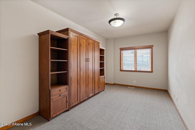 303 S 11th St, Coeur Dalene, ID 83814 - unfurnished bedroom featuring baseboards and light colored carpet