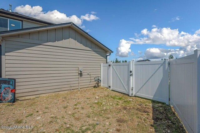 16171 N Hadley Loop, Rathdrum, ID 83858 - view of property exterior with a gate and board and batten siding