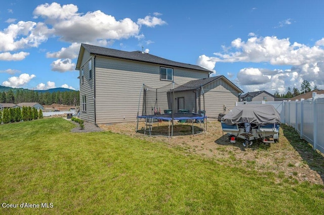 16171 N Hadley Loop, Rathdrum, ID 83858 - back of property featuring a trampoline and a mountain view