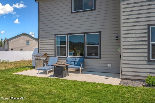 16171 N Hadley Loop, Rathdrum, ID 83858 - back of house with a patio and an outdoor fire pit
