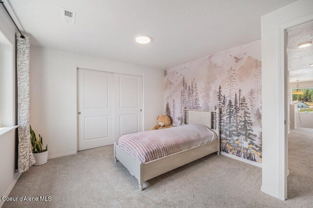 16171 N Hadley Loop, Rathdrum, ID 83858 - carpeted bedroom featuring baseboards and a closet