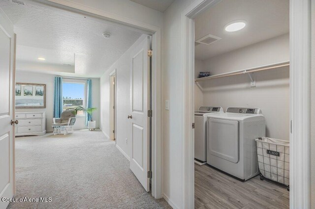 16171 N Hadley Loop, Rathdrum, ID 83858 - washroom with independent washer and dryer and wood finished floors