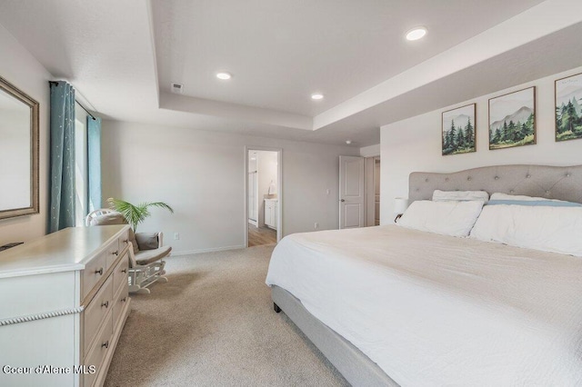 16171 N Hadley Loop, Rathdrum, ID 83858 - bedroom featuring light colored carpet, recessed lighting, baseboards, a tray ceiling, and ensuite bathroom