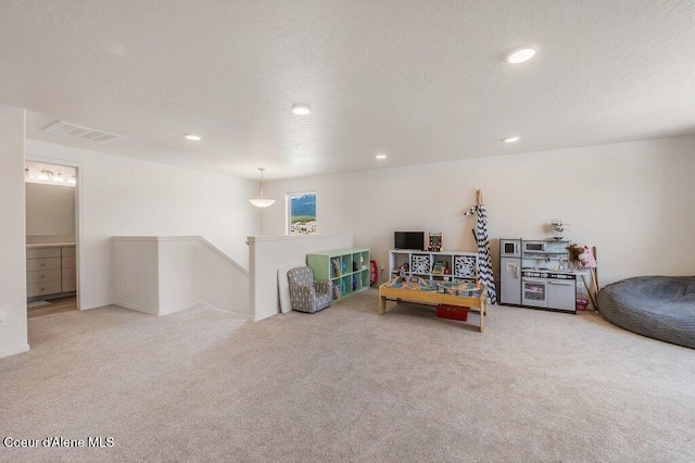 16171 N Hadley Loop, Rathdrum, ID 83858 - playroom with carpet flooring, recessed lighting, and a textured ceiling
