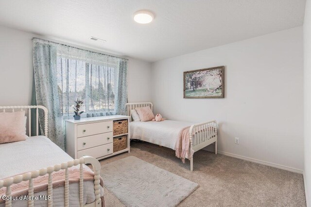 16171 N Hadley Loop, Rathdrum, ID 83858 - bedroom with carpet floors and baseboards